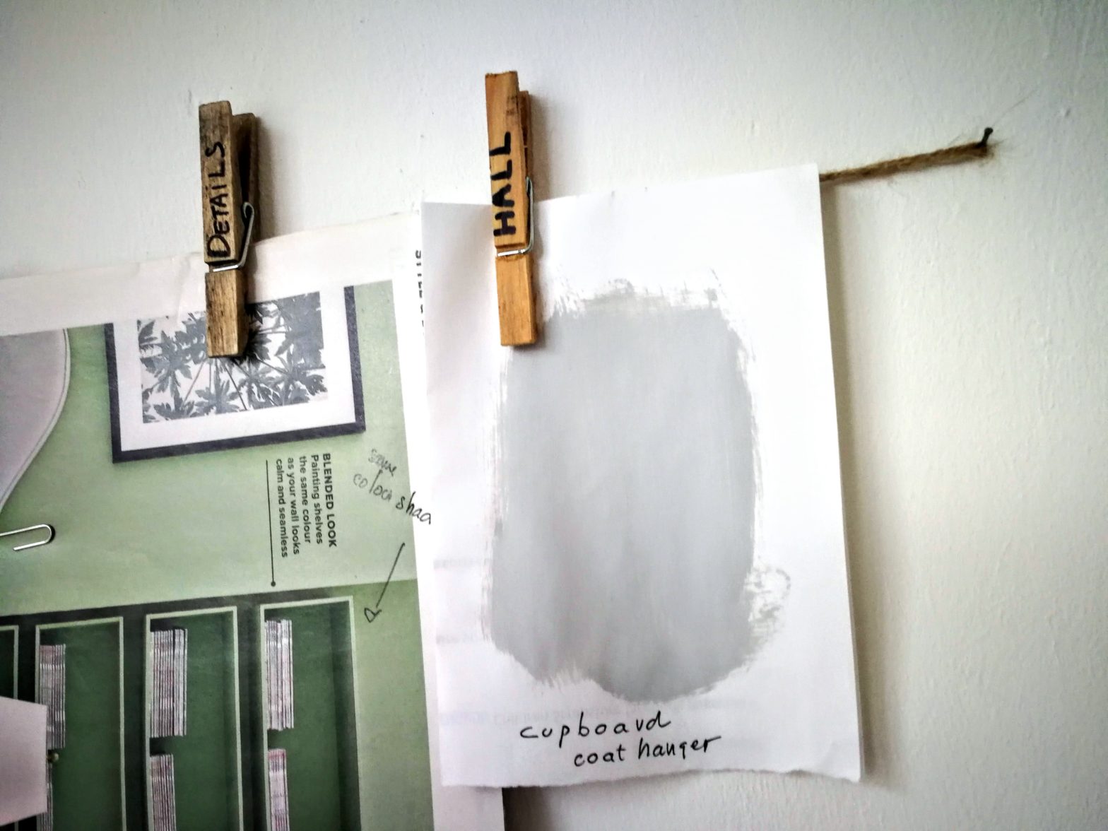 wooden pins holding paint colour samples and mood board